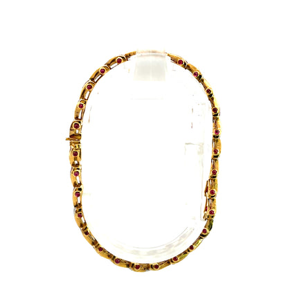 Modern 18KY gold, ruby and diamond 'V' link line bracelet