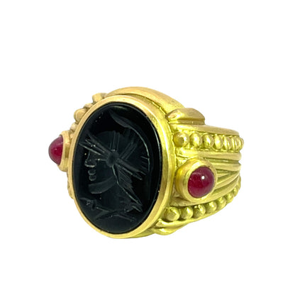 Modern 18 KY gold, ruby and carved onyx Judith Ripka ring