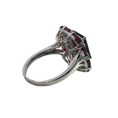 Modern Platinum, diamond and garnet halo ring