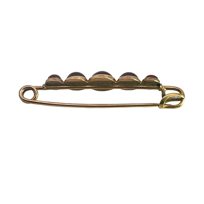 Victorian 10KY gold, and garnet cabochon collar pin