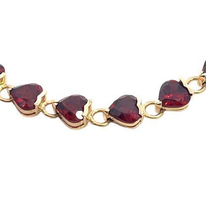 Modern 14KY gold and heart shaped garnet link tennis bracelet