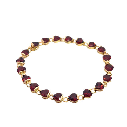 Modern 14KY gold and heart shaped garnet link tennis bracelet