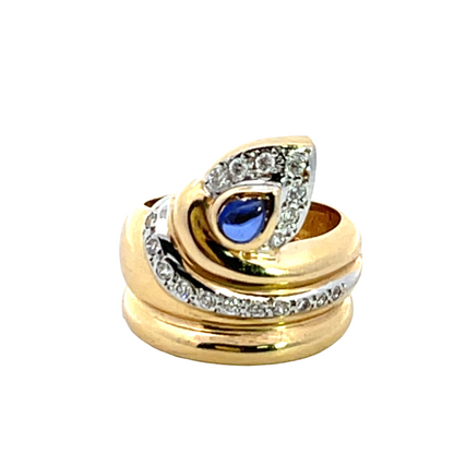 Modern 14K yellow and white gold diamond and sapphire snake ring